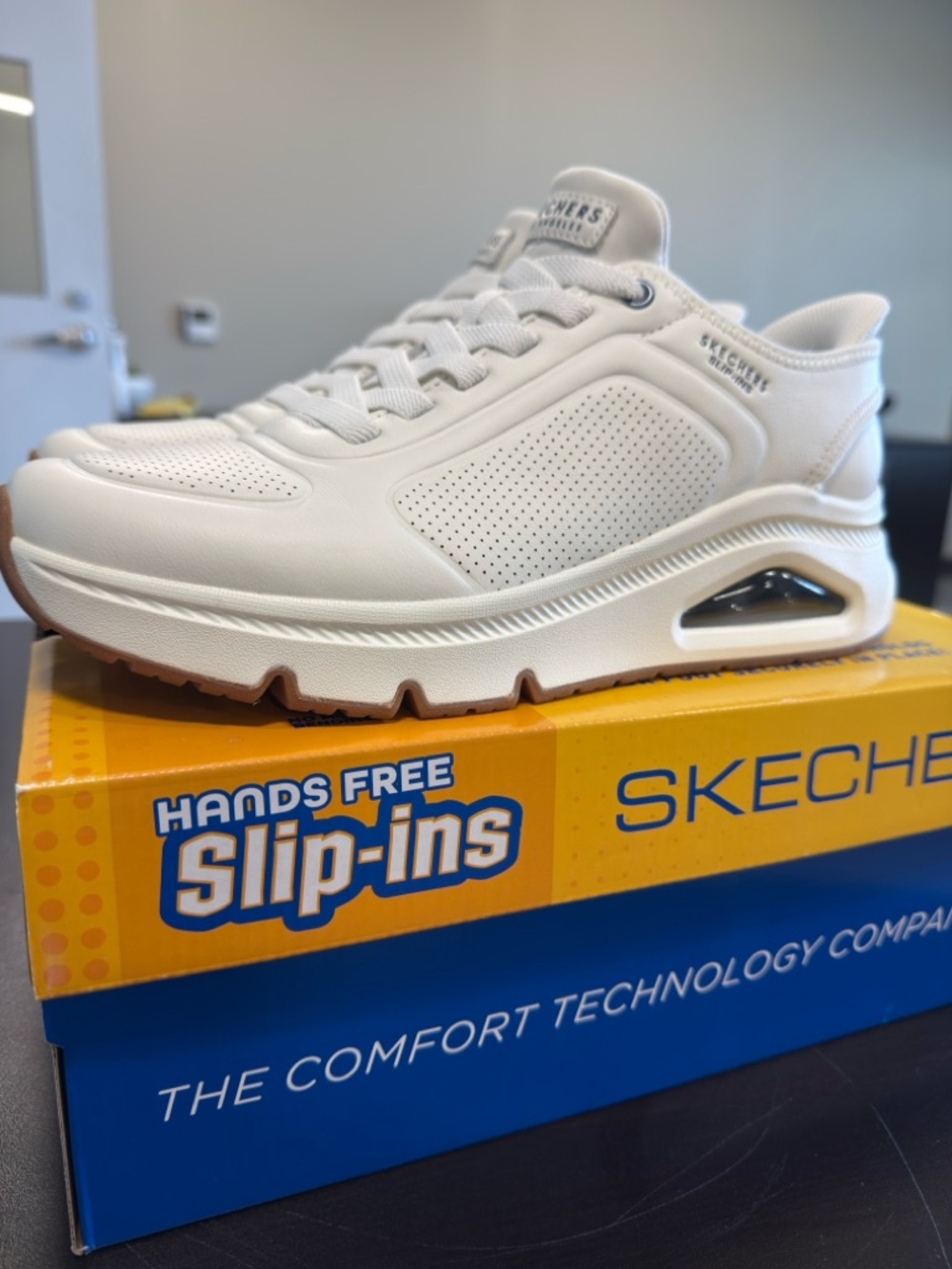 Skechers UNO Men’s White Slip-In Athletic Sneaker
